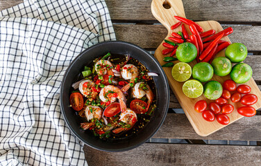 Fresh shrimp on a plate and fresh vegetables, cooked shrimp prawns and seafood spicy chili sauce coriander, cooked shrimp salad lemon-lime