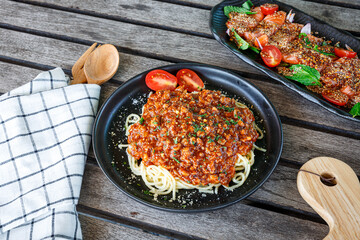 Traditional italian spaghetti bolognese on a plate. Bolognese sauce is classic italian cuisine dish. Popular italian food.