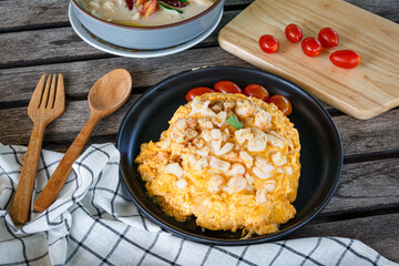Crab omelette over rice, The fluffy omelette with chunks of fresh crab meat is placed on a mound of steamed rice.
