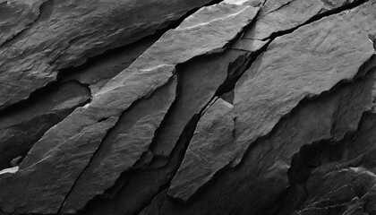 abstract, dark textured background with shades of grey, black, and white resembling a rugged mountain surface, conveying strength and resilience in its raw, natural beauty - obrazy, fototapety, plakaty