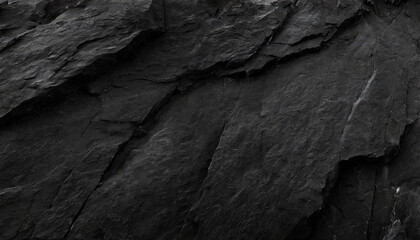 abstract, dark textured background with shades of grey, black, and white resembling a rugged...