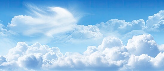 Naklejka na ściany i meble Background of a sky that is blue with clouds