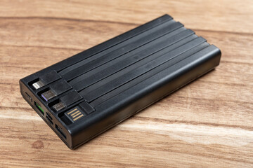 black portable power bank with different plugs