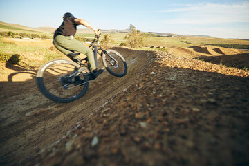 Mountain bike, sports and man outdoor in nature for adrenaline, training or workout. Bicycle,...