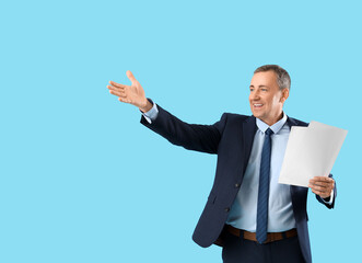 Mature actor with film script on blue background