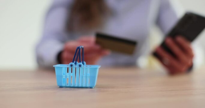 Shopping cart for people with bank card and smartphone