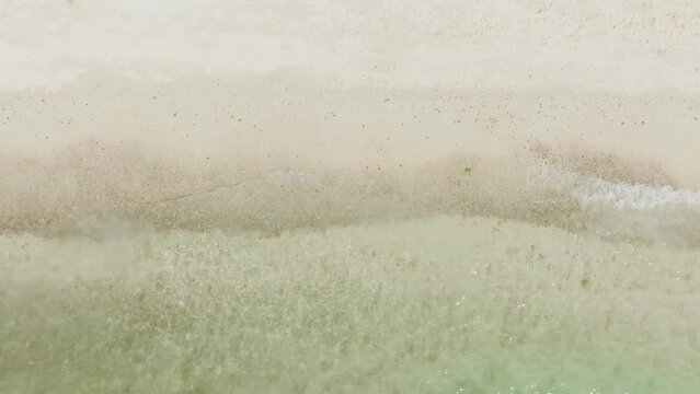 Top view of background for summer vacation concept. Nature of the beach and sea, summer with sunlight, sandy beach The sparkling sea water