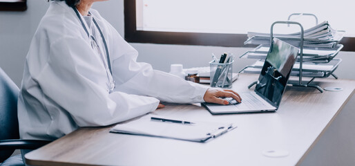 Online training. Young Latin American girl student doctor studies online at home from laptop