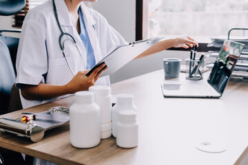 Medical technology concept. Doctor working with mobile phone and stethoscope in modern office