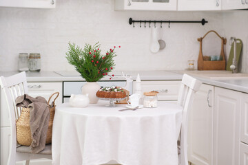 Christmas home interior in white kitchen Christmas chocolate bundt cake with fresh berries and rosemary. Winter baking. christmas trees. High quality photo