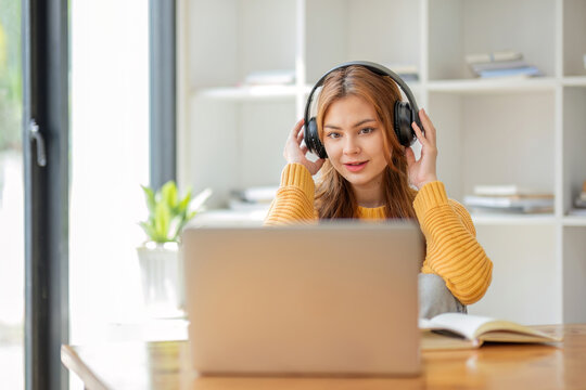 Asian girl student online learning class study online video call zoom teacher, Happy asian girl learn english language online with computer laptop.