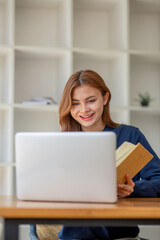 Fototapeta premium Asian girl student online learning class study online video call zoom teacher, Happy asian girl learn language online with computer laptop.