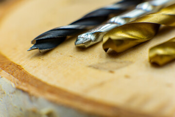 Macro close up of drills on wooden background