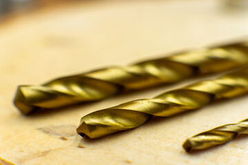 Macro close up of drills on wooden background