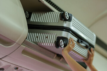 Businesswoman, confident tourist walks with suitcase, checks seat, flight number, puts her suitcase...