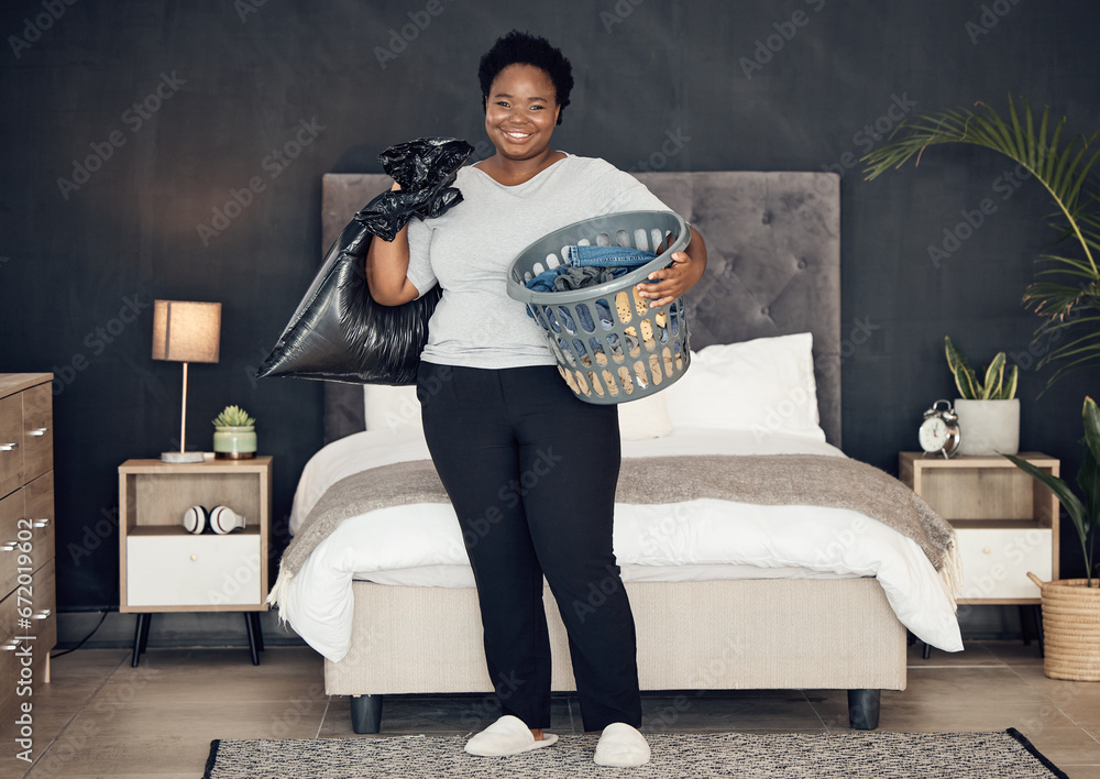 Poster Black woman, clothes in basket and cleaning bedroom, garbage bag and hygiene with portrait in bedroom. Female person, cleaner and housekeeping with smile, laundry and maintenance with morning routine