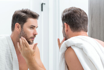 Mens beauty. Cream treatment for mens face. Beauty routine. Face of a beauty man with perfect skin. Anti-aging and wrinkle cream. Concept of male beauty. Male skincare cosmetics concept. Skin care.