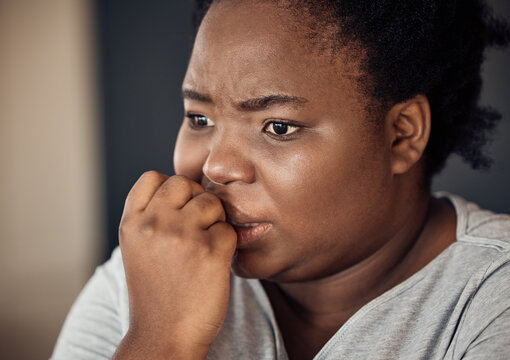 Nervous, scared and black woman with stress, anxiety or trauma from broken heart or divorce at home. Fear, biting nails or face of person worried by loss or disaster of death or frustrated by crisis