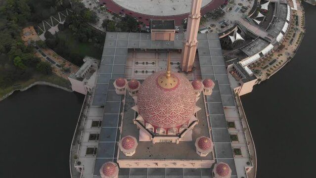 Top down shot of big pink Putra mosque at Kuala lumpur, aerial