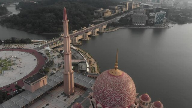 Tilt down shot of big Putra mosgue at Putra jaya Malaysia, aerial