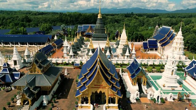 4K Cinematic nature aerial drone footage of the beautiful temple of Wat Ban Den next to Chiang Mai, Thailand on a sunny day