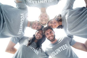 Digital png photo of diverse volunteers embracing on transparent background