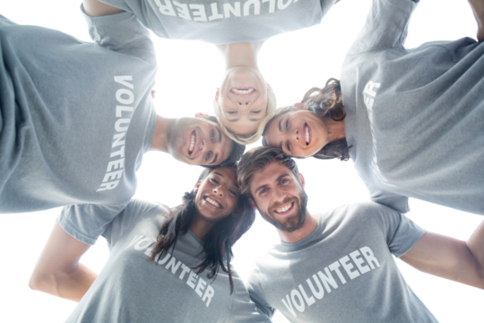 Digital png photo of diverse volunteers embracing on transparent background