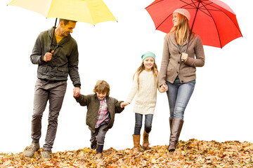 Digital png photo of happy caucasian family walking in park with umbrellas on transparent background