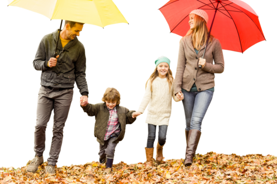 Digital png photo of happy caucasian family walking in park with umbrellas on transparent background