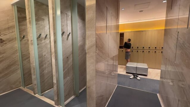 Timelapse of Asian Millennial Man Exiting Shower and Dressing Up in Luxurious Changing Room