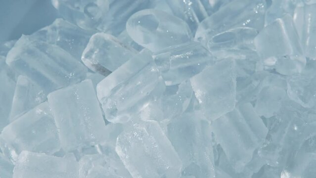 Close up and handheld Footage of Hand scooping fresh cool ice tube background and texture.
