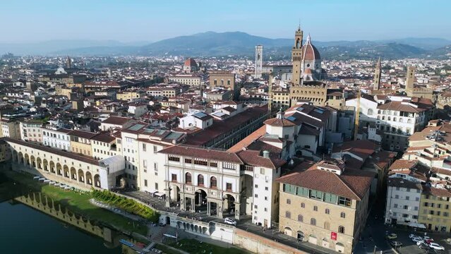 Fantastic aerial top view flight 
medieval bridge town Florence river Tuscany Italy. rotation to left drone
4k cinematic