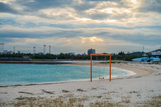 At dusk, a swing stands on the seaside of Nishihara Marine Park,Okinawa,Japan