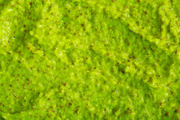 Smoothie with fresh green vegetables and fruits. Berry and yogurt ice cream. The texture of the sorbet. Delicious sweet dessert close-up as a background.