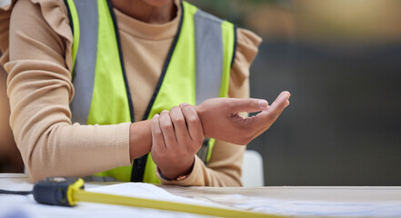 Industry, closeup and female construction worker with wrist pain, injury or accident in her office....