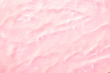 Cosmetic gel, serum transparent sample. Liquid cream with bubble texture. Gel texture of a cosmetic product. Clear liquid lotion for skin care.