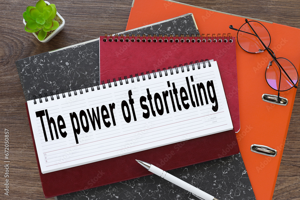 Poster the power of storytelling. diary with text on orange folder
