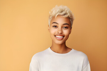 Young adult happy Black woman beauty female model, pretty cool gen z African lady with short blond hair healthy face skin and nose piercing looking at camera isolated at beige background - obrazy, fototapety, plakaty