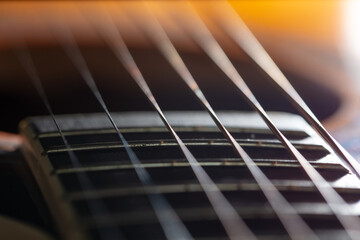 Strings on an acoustic guitar. Close-up