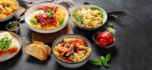 Assortment of Italian pasta with traditional sauces for dinner. Homemade food concept.