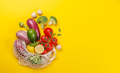 Mesh bag filled with a variety of vegetables