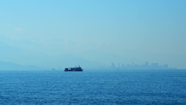 Fishing Boat Sails For Fishing. Fishing Boat In The Middle Of The Sea. Real time.