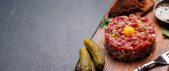 Savory beef tartare and brown bread toasts