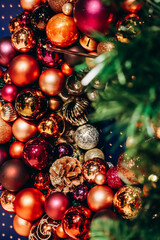 Close-up of Christmas decorations: colorful Christmas balls and fir branches
