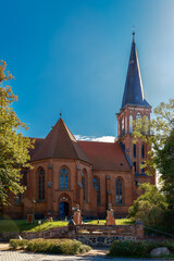 Fototapeta na wymiar Auf einem Hügel liegt die denkmalgeschützte Kirche in Wustrow, Ansicht von Norden - Inschriften wurden retuschiert