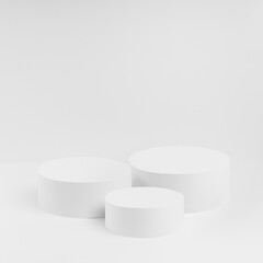 Abstract three white round podiums for cosmetic products, mockup on white background. Stage for presentation products, gifts, goods, advertising, design, sale, text, display, showing in simple style.
