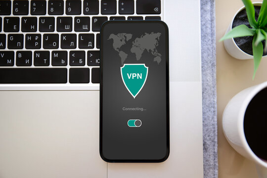 phone with app vpn screen background of keyboard in office