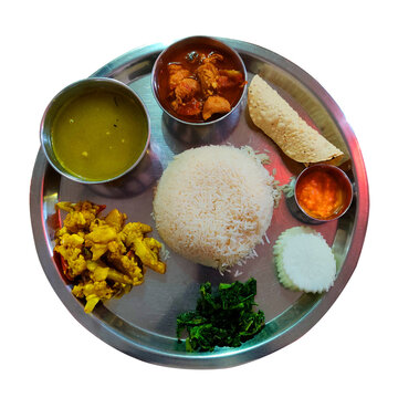 Daal Bhat is a traditional Nepali Food with chicken Curry, Lentils, Spinach, and Rice. Traditional Nepali Thakali Dish of Rice, Lentils, Curry, and Chutney aka Daal Bhaat.