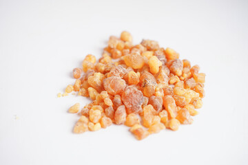 Frankincense or olibanum aromatic resin isolated on white background used in incense and perfumes.