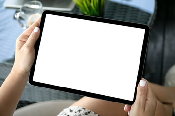 female hands hold computer tablet with isolated screen in office